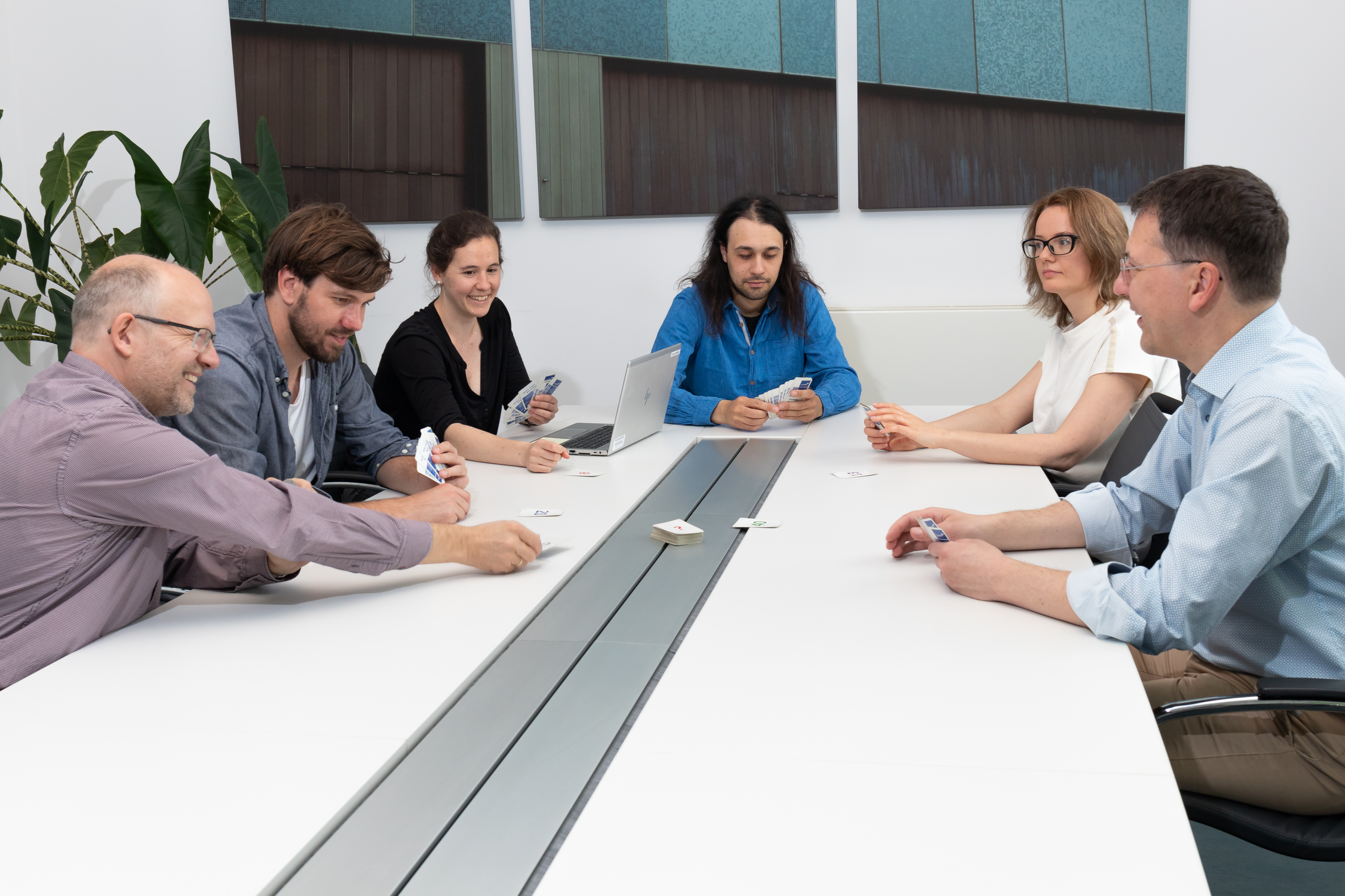 entimo software development team using Planning Poker for collaborative agile project estimation.