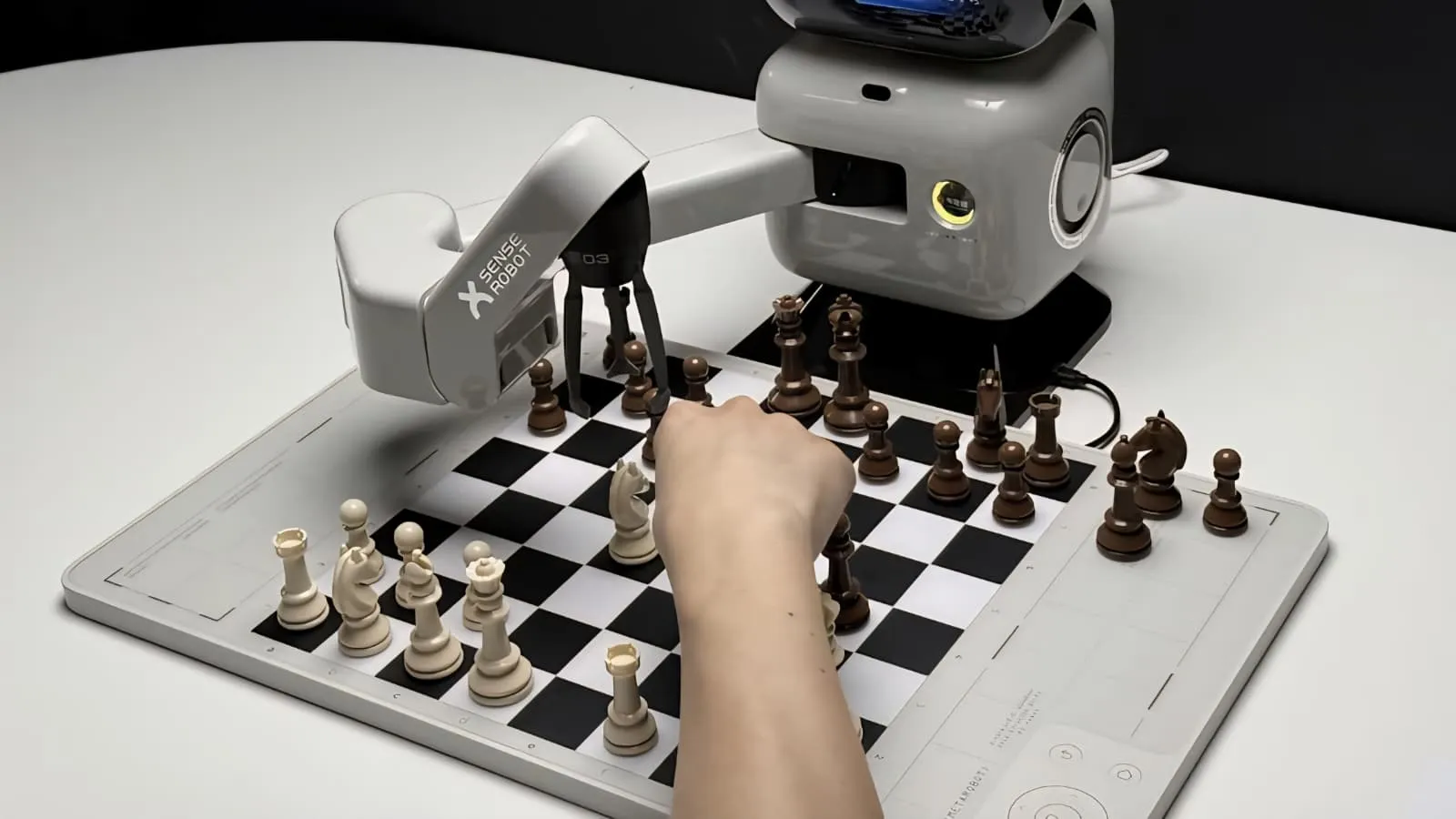 Person playing chess against a robotic arm – human review of AI-generated code