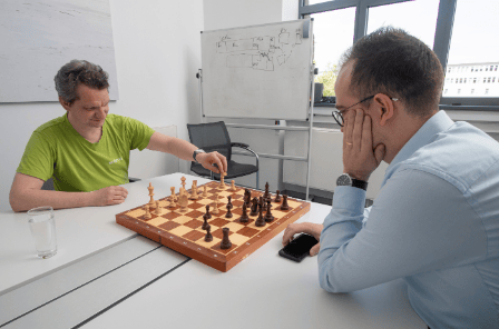 Two members of entimo's team engaged in a game of chess.